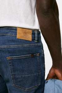 Lightweight distressed dark wash slim fit jeans
