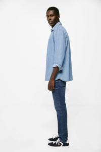 Lightweight distressed dark wash slim fit jeans